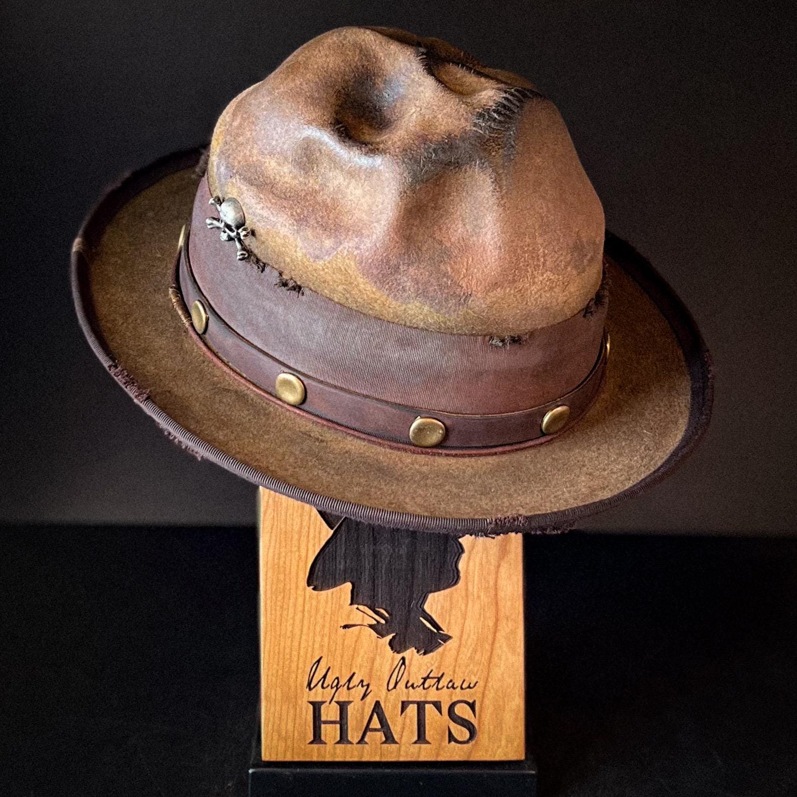 The “Skull of my Enemy” size 7 1/2 long oval from Ugly Outlaw Hats.