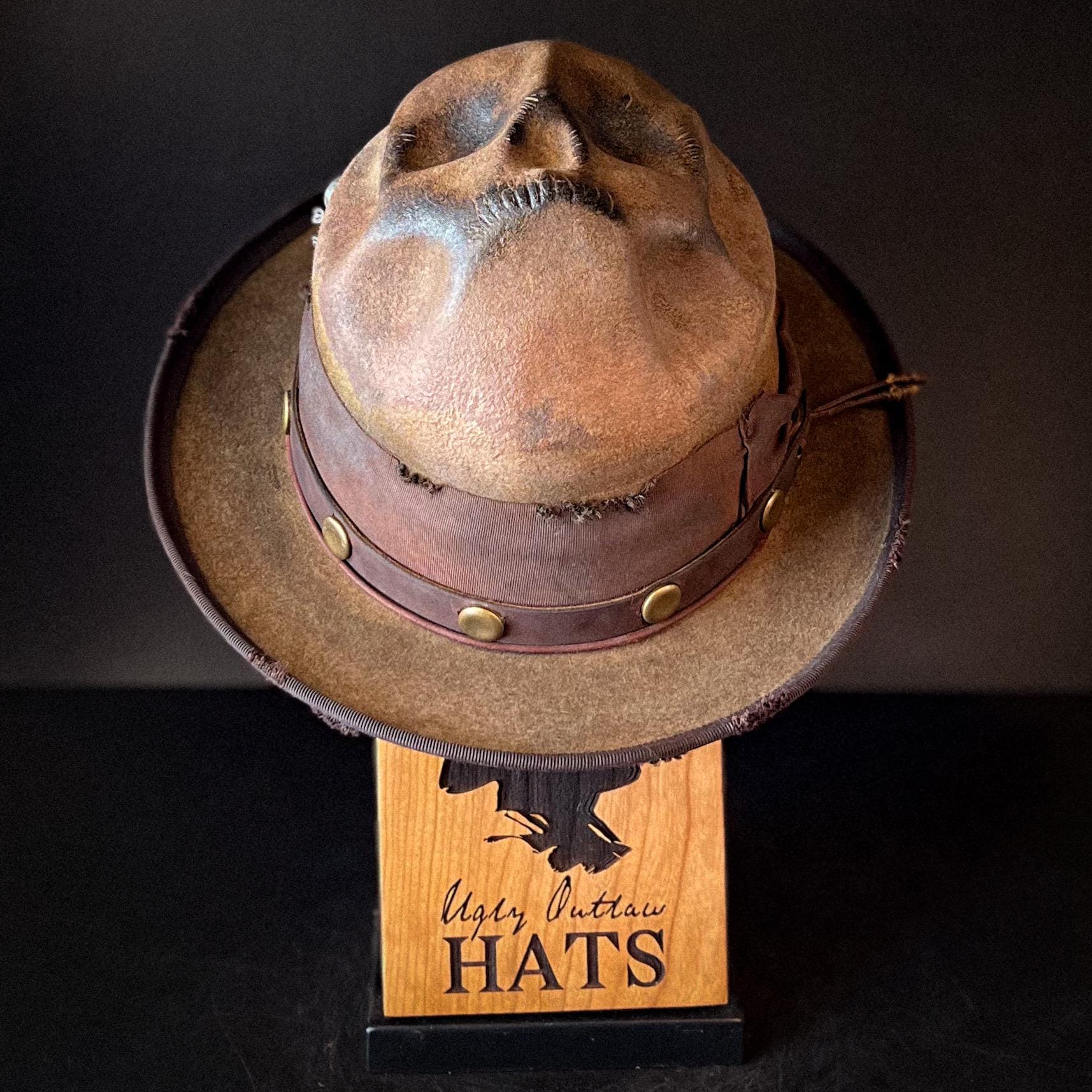 The “Skull of my Enemy” size 7 1/2 long oval from Ugly Outlaw Hats.